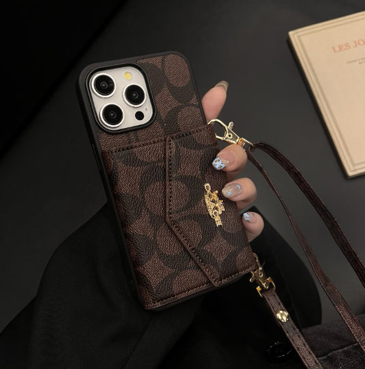 コーチ iPhone ケース カードホルダーとストラップ付き ダーク
